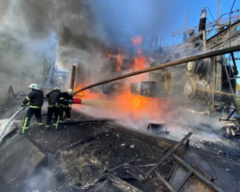 Firefighters work at a site of a Russian missile strike in Kyiv