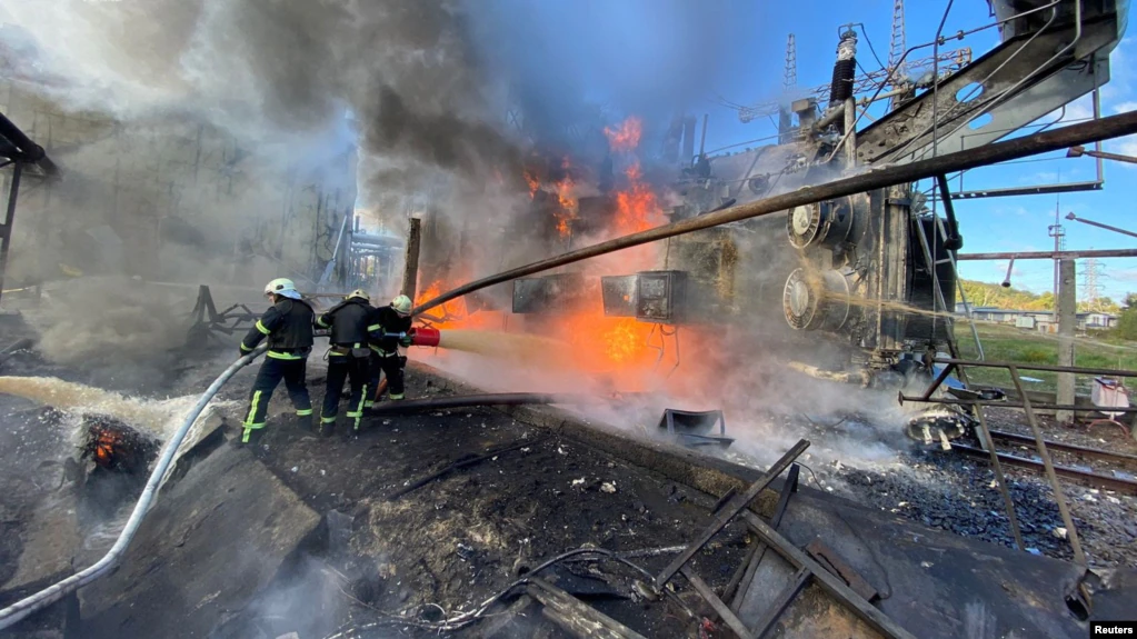 Firefighters work at a site of a Russian missile strike in Kyiv