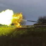 Ukrainian soldiers fire at Russian forces