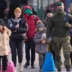 People fleeing from Ukraine cross the border