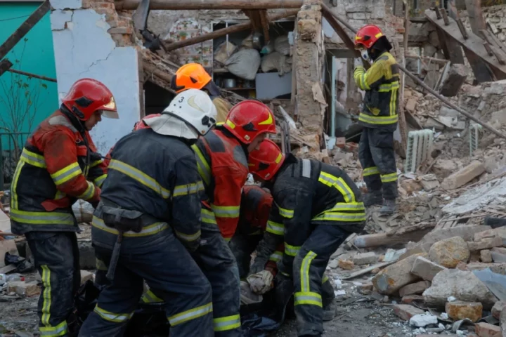 e body of a woman found under debris